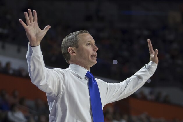 Florida head coach Mike White signals to his team during the first half of an NCAA college basketball game against Loyola of Chicago in Gainesville, Fla., Wednesday, Dec. 6, 2017. (AP Photo/Ron Irby)