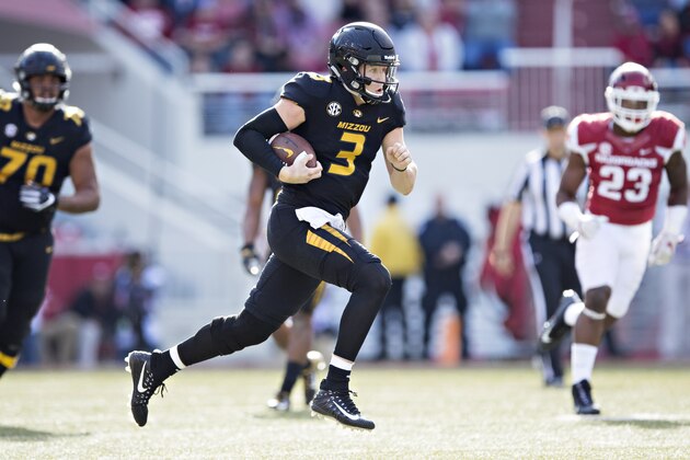 FAYETTEVILLE, AR - NOVEMBER 24:  Drew Lock #3 of the Missouri Tigers runs the ball during a game against the Arkansas Razorbacks at Razorback Stadium on November 24, 2017 in Fayetteville, Arkansas.  (Photo by Wesley Hitt/Getty Images)