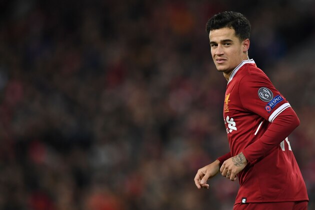 Liverpool's Brazilian midfielder Philippe Coutinho celebrates scoring their fifth goal and completing his hattrick during the UEFA Champions League Group E football match between Liverpool and Spartak Moscow at Anfield in Liverpool, north-west England on December 6, 2017. / AFP PHOTO / Paul ELLIS        (Photo credit should read PAUL ELLIS/AFP/Getty Images)