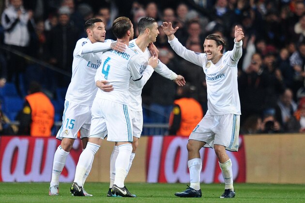 MADRID, SPAIN - DECEMBER 06: Cristiano Ronaldo of Real Madrid CF celebrates with Sergio Ramos (left) and Mateo Kovacic after scoring Real's 2nd goal during the UEFA Champions League group H match between Real Madrid and Borussia Dortmund at Estadio Santiago Bernabeu on December 6, 2017 in Madrid, Spain. (Photo by Denis Doyle/Getty Images)