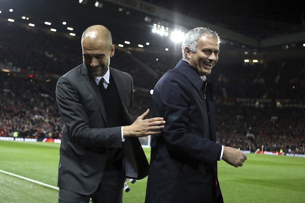 FILE - In this Wednesday, Oct. 26, 2016 file photo, Manchester City's manager Pep Guardiola, left, and Manchester United's manager Jose Mourinho smile ahead of their English League Cup soccer match at Old Trafford stadium in Manchester. There were handshakes, smiles, even an embrace, in the first two head-to-heads between Pep Guardiola and Jose Mourinho in English soccer. With the pressure and tension ramped up a notch for the third Manchester derby of the season, will the two coaching adversaries be able to retain their new-found cordiality on Thursday, April 27? (AP Photo/Dave Thompson, file)