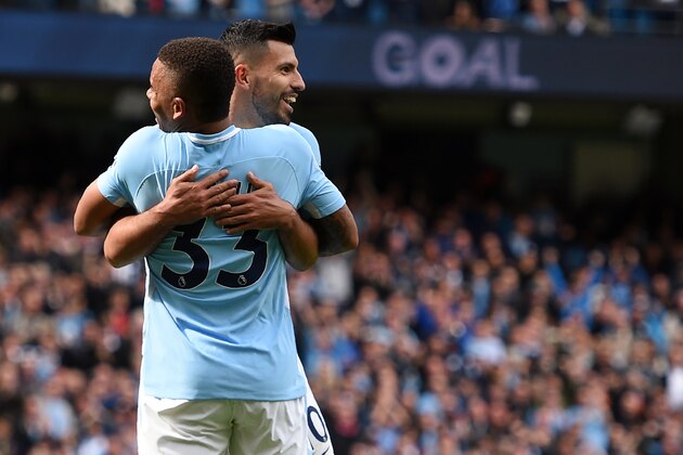 Manchester City's Brazilian striker Gabriel Jesus (L) celebrates with Manchester City's Argentinian striker Sergio Aguero after scoring their third goal during the English Premier League football match between Manchester City and Liverpool at the Etihad Stadium in Manchester, north west England, on September 9, 2017. / AFP PHOTO / Oli SCARFF / RESTRICTED TO EDITORIAL USE. No use with unauthorized audio, video, data, fixture lists, club/league logos or 'live' services. Online in-match use limited to 75 images, no video emulation. No use in betting, games or single club/league/player publications.  /         (Photo credit should read OLI SCARFF/AFP/Getty Images)