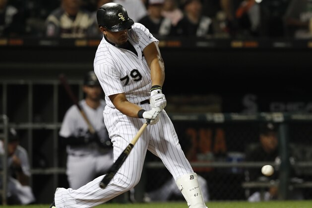 Chicago White Sox's Jose Abreu hits his 100th RBI of the season during the seventh inning of a baseball game against the Kansas City Royals Saturday, Sept. 23, 2017, in Chicago. (AP Photo/Jim Young)