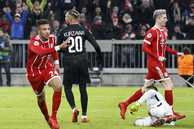 Bayern's Corentin Tolisso, left, celebrates after scoring his side's second goal during the Champions League Group B soccer match between FC Bayern Munich and Paris Saint-Germain, at Allianz Arena stadium in Munich, Germany, Tuesday, Dec. 5, 2017. (AP Photo/Thomas Schmidtutz)
