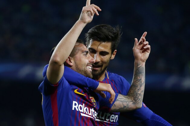 Barcelona's Paco Alcacer celebrates his opening goal during the Champions League Group D soccer match between FC Barcelona and Sporting CP at the Camp Nou stadium in Barcelona, Spain, Tuesday, Dec. 5, 2017. (AP Photo/Manu Fernandez)