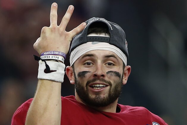 ARLINGTON, TX - DECEMBER 2: Baker Mayfield #6 of the Oklahoma Sooners celebrates after defeating the TCU Horned Frogs 41-17 in the Big 12 Championship AT&T Stadium on December 2, 2017 in Arlington, Texas. (Photo by Ron Jenkins/Getty Images)