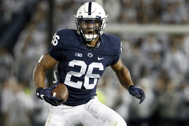 Penn State's Saquon Barkley (26) runs the ball against Michigan during the first half of an NCAA college football game in State College, Pa., Saturday, Oct. 21, 2017. (AP Photo/Chris Knight)