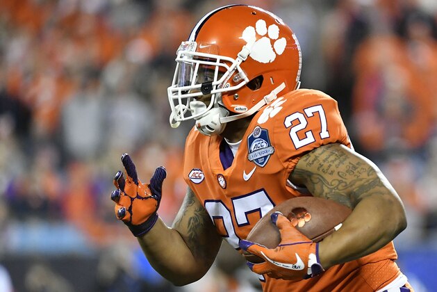 CHARLOTTE, NC - DECEMBER 02:  C.J. Fuller #27 of the Clemson Tigers runs the football against the Miami Hurricanes during the ACC Football Championship at Bank of America Stadium on December 2, 2017 in Charlotte, North Carolina.  (Photo by Mike Comer/Getty Images)