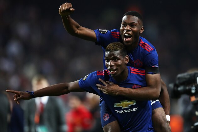 STOCKHOLM, SWEDEN - MAY 24:  Paul Pogba of Manchester United celerbates with Timothy Fosu-Mensah of Manchester United after the UEFA Europa League Final between Ajax and Manchester United at Friends Arena on May 24, 2017 in Stockholm, Sweden.  (Photo by Julian Finney/Getty Images)