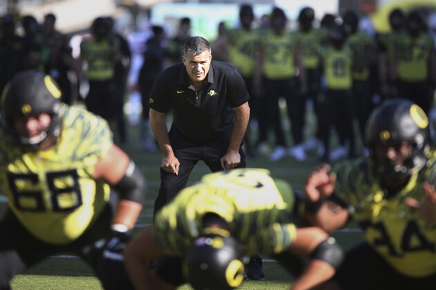 Oregon co-offensive coordinator Mario Cristobal watches a special team warmup drill before Oregon's game against Utah in an NCAA college football game Saturday, Oct. 28, 2017, in Eugene, Ore. (AP Photo/Chris Pietsch)