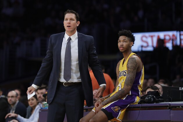 Los Angeles Lakers head coach Luke Walton, left, and Brandon Ingram watch action during the first half of an NBA preseason basketball game against the Denver Nuggets, Friday, Oct. 7, 2016, in Los Angeles. (AP Photo/Jae C. Hong)