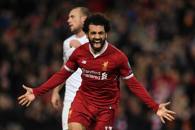 Liverpool's Egyptian midfielder Mohamed Salah celebrates scoring their seventh goal during the UEFA Champions League Group E football match between Liverpool and Spartak Moscow at Anfield in Liverpool, north-west England on December 6, 2017. / AFP PHOTO / Paul ELLIS        (Photo credit should read PAUL ELLIS/AFP/Getty Images)