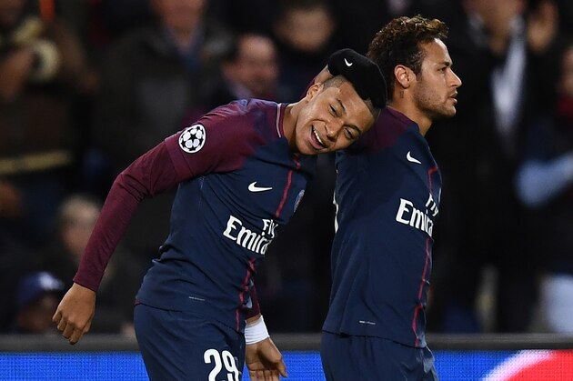 Paris Saint-Germain's Brazilian striker Neymar (R) and French striker Kylian Mbappe react during the UEFA Champions League Group B football match between Paris Saint-Germain (PSG) and Glasgow Celtic at Parc des Princes Stadium in Paris on November 22, 2017.  / AFP PHOTO / FRANCK FIFE        (Photo credit should read FRANCK FIFE/AFP/Getty Images)