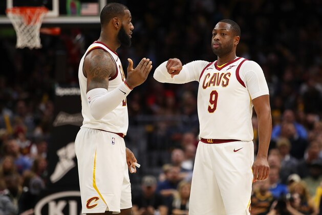 CLEVELAND, OH - NOVEMBER 28:  LeBron James #23 of the Cleveland Cavaliers talks with Dwyane Wade #9 while playing the Miami Heat at Quicken Loans Arena on November 28, 2017 in Cleveland, Ohio. Cleveland won the game 108-97. NOTE TO USER: User expressly acknowledges and agrees that, by downloading and or using this photograph, User is consenting to the terms and conditions of the Getty Images License Agreement.  (Photo by Gregory Shamus/Getty Images)
