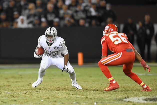 OAKLAND, CA - OCTOBER 19:  Jalen Richard #30 of the Oakland Raiders runs with the ball while pursued by Derrick Johnson #56 of the Kansas City Chiefs during their NFL football game at Oakland-Alameda County Coliseum on October 19, 2017 in Oakland, California.  (Photo by Thearon W. Henderson/Getty Images)