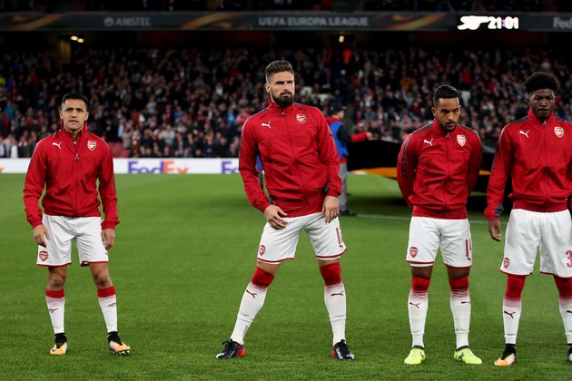 LONDON, ENGLAND - SEPTEMBER 14: Alexis Sanchez of Arsenal stands away from Olivier Giroud;Theo Walcott and Ainsley Maitland-Niles of Arsenal as teams line up before the UEFA Europa League group H match between Arsenal FC and 1. FC Koeln at Emirates Stadium on September 14, 2017 in London, United Kingdom. (Photo by Catherine Ivill - AMA/Getty Images)