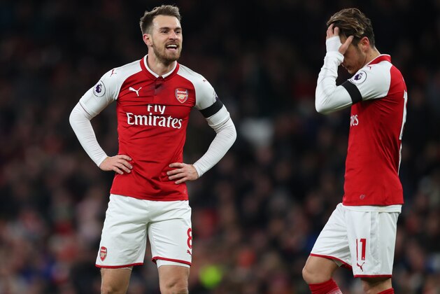 LONDON, ENGLAND - NOVEMBER 29: Aaron Ramsey of Arsenal and Mesut Ozil of Arsenal during the Premier League match between Arsenal and Huddersfield Town at Emirates Stadium on November 29, 2017 in London, England. (Photo by Catherine Ivill/Getty Images)