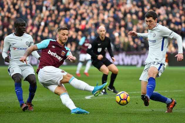 LONDON, ENGLAND - DECEMBER 09: Marko Arnautovic of West Ham United shoots as Andreas Christensen of Chelsea attempts to block during the Premier League match between West Ham United and Chelsea at London Stadium on December 9, 2017 in London, England.  (Photo by Dan Mullan/Getty Images)