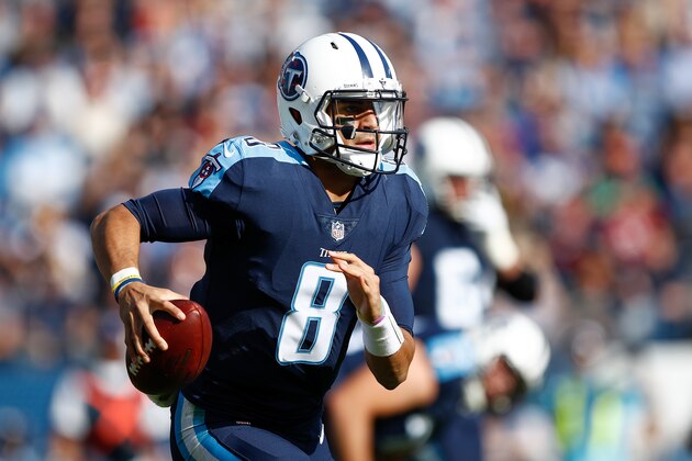 NASHVILLE, TN - DECEMBER 03:  Marcus Mariota #8 of the Tennessee Titans scrambles with the ball against the Houston Texans during the first half at Nissan Stadium on December 3, 2017 in Nashville, Tennessee.  (Photo by Wesley Hitt/Getty Images)