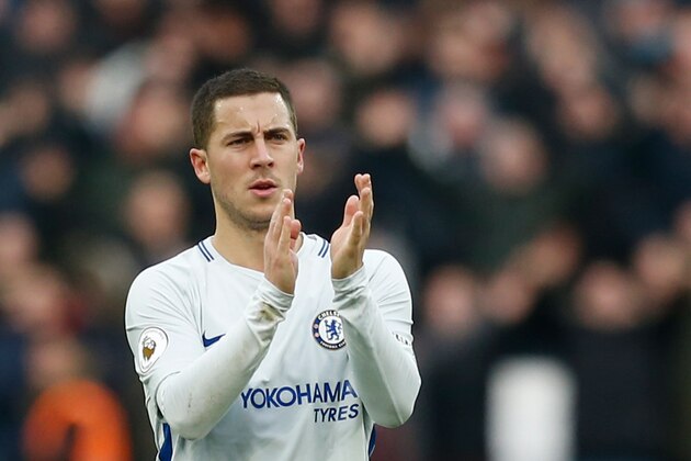 Chelsea's Belgian midfielder Eden Hazard applauds supporters on the pitch after the English Premier League football match between West Ham United and Chelsea at The London Stadium, in east London on December 9, 2017.
West Ham won the game 1-0. / AFP PHOTO / Ian KINGTON / RESTRICTED TO EDITORIAL USE. No use with unauthorized audio, video, data, fixture lists, club/league logos or 'live' services. Online in-match use limited to 75 images, no video emulation. No use in betting, games or single club/league/player publications.  /         (Photo credit should read IAN KINGTON/AFP/Getty Images)
