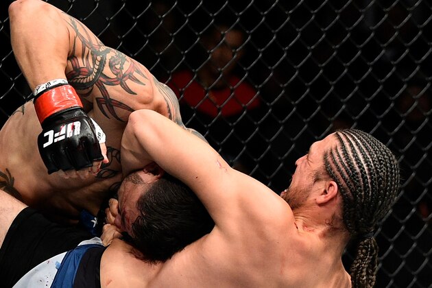 FRESNO, CA - DECEMBER 09:  (R-L) Brian Ortega attempts to submit Cub Swanson in their featherweight bout during the UFC Fight Night event inside Save Mart Center on December 9, 2017 in Fresno, California. (Photo by Jeff Bottari/Zuffa LLC/Zuffa LLC via Getty Images)
