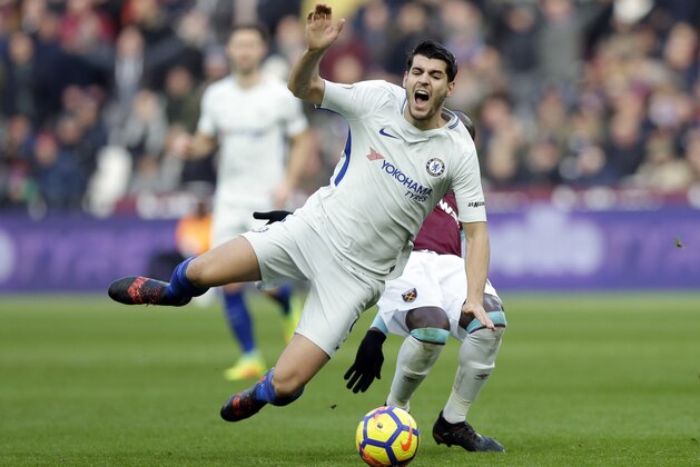 Chelsea's Alvaro Morata is faulted by West Ham United's Pedro Obiang during the English Premier League soccer match between West Ham United and Chelsea at the London stadium in London, Saturday, Dec. 9, 2017. (AP Photo/Alastair Grant)