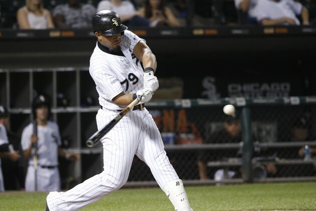 Chicago White Sox's Jose Abreu swings into a home run off Los Angeles Angels starting pitcher Parker Bridwell during the sixth inning of a baseball game Tuesday, Sept. 26, 2017, in Chicago. (AP Photo/Charles Rex Arbogast)