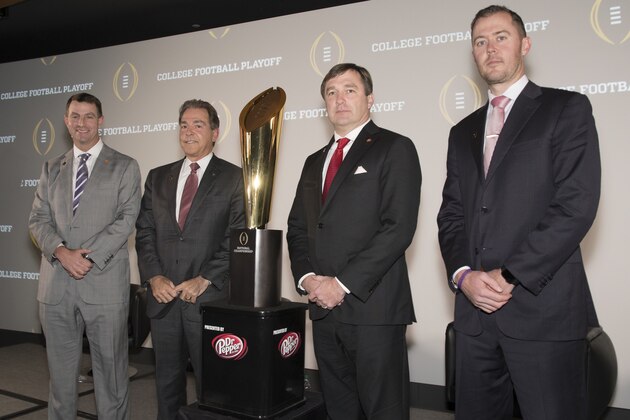 The coaches of the four teams in the College Football Playoff, Lincoln Riley, right, of Oklahoma; Kirby Smart, second from right, of Georgia; Nick Saban, of Alabama; and Dabo Swinney, left, of Clemson, pose together before the College Football Awards show at the College Football Hall of Fame, Thursday, Dec. 7, 2017, in Atlanta. (AP Photo/John Amis)