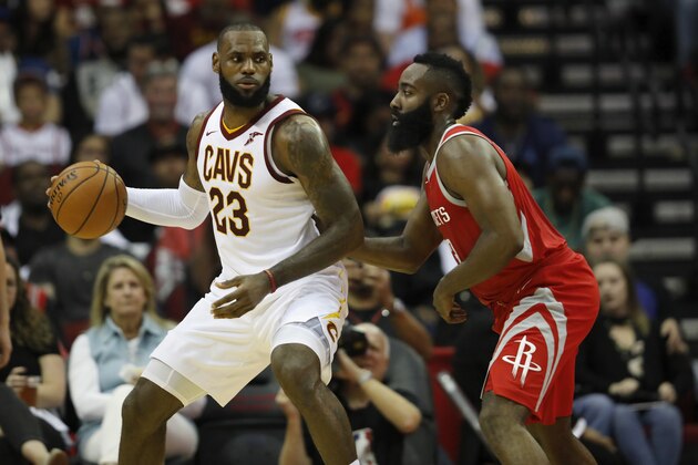 HOUSTON, TX - NOVEMBER 09:  LeBron James #23 of the Cleveland Cavaliers controls the ball against James Harden #13 of the Houston Rockets in the first half at Toyota Center on November 09, 2017 in Houston, Texas.  NOTE TO USER: User expressly acknowledges and agrees that, by downloading and or using this photograph, User is consenting to the terms and conditions of the Getty Images License Agreement.  (Photo by Tim Warner/Getty Images)