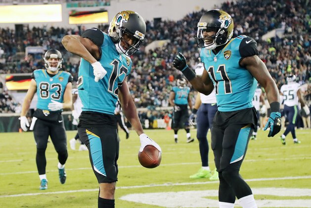 JACKSONVILLE, FL - DECEMBER 10:  Dede Westbrook #12 and Marqise Lee #11 of the Jacksonville Jaguars celebrate after Westbrook scored an 18-yard touchdown against the Seattle Seahawks during the second half of their game at EverBank Field on December 10, 2017 in Jacksonville, Florida.  (Photo by Sam Greenwood/Getty Images)