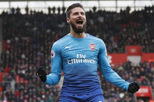 Arsenal's French striker Olivier Giroud celebrates scoring the team's first goal during the English Premier League football match between Southampton and Arsenal at St Mary's Stadium in Southampton, southern England on December 10, 2017. / AFP PHOTO / Adrian DENNIS / RESTRICTED TO EDITORIAL USE. No use with unauthorized audio, video, data, fixture lists, club/league logos or 'live' services. Online in-match use limited to 75 images, no video emulation. No use in betting, games or single club/league/player publications.  /         (Photo credit should read ADRIAN DENNIS/AFP/Getty Images)