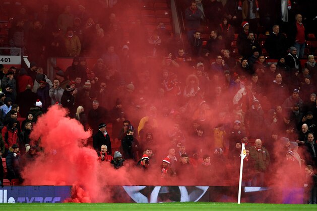 MANCHESTER, ENGLAND - DECEMBER 10:  A flare goes of at Old Trafford during the Premier League match between Manchester United and Manchester City at Old Trafford on December 10, 2017 in Manchester, England.  (Photo by Michael Regan/Getty Images)