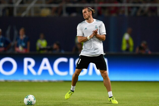 SKOPJE, MACEDONIA - AUGUST 08: Gareth Bale of Real Madrid shows appreciation to the fans as he warms up prior to the UEFA Super Cup final between Real Madrid and Manchester United at the Philip II Arena on August 8, 2017 in Skopje, Macedonia.  (Photo by Dan Mullan/Getty Images)