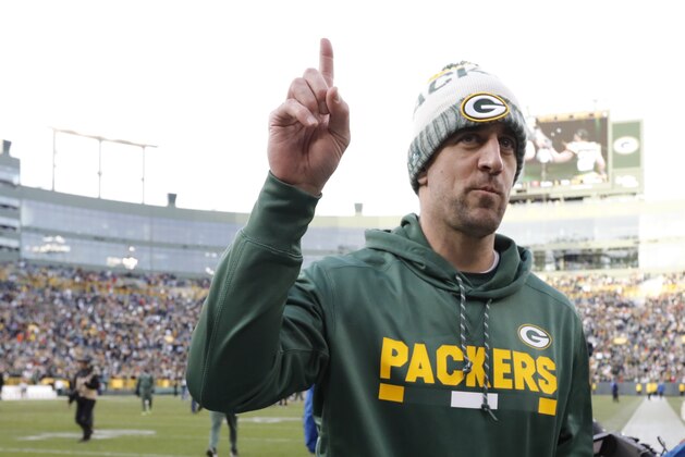 Green Bay Packers' Aaron Rodgers celebrates after overtime of an NFL football game against the Tampa Bay Buccaneers Sunday, Dec. 3, 2017, in Green Bay, Wis. The Packers won 26-20. (AP Photo/Mike Roemer)