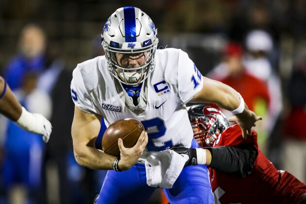 BOWLING GREEN, KY - NOVEMBER 17: Quarterback Brent Stockstill #12 of the Middle Tennessee Blue Raiders escapes a tackle in a game against Western Kentucky University at L.T. Smith Stadium on November 17, 2017 in Bowling Green, Kentucky. (Photo by Shaban Athuman/Getty Images)