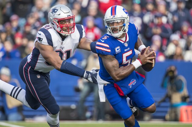ORCHARD PARK, NY - DECEMBER 03:  Tyrod Taylor #5 of the Buffalo Bills scrambles with the ball during the opening play of the game against the New England Patriots at New Era Field on December 3, 2017 in Orchard Park, New York. New England defeats Buffalo 23-3.  (Photo by Brett Carlsen/Getty Images)