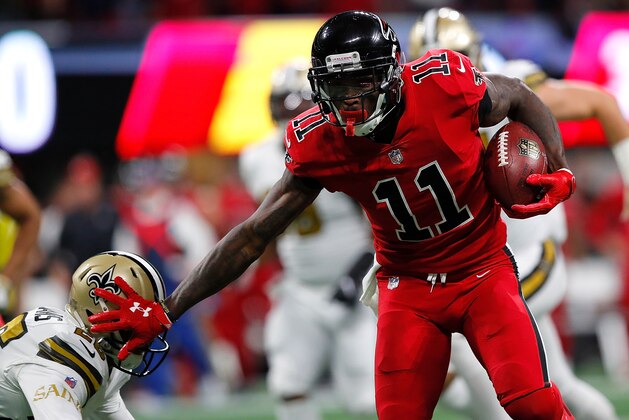 ATLANTA, GA - DECEMBER 07:  Julio Jones #11 of the Atlanta Falcons stiff arms P.J. Williams #26 of the New Orleans Saints after a reception at Mercedes-Benz Stadium on December 7, 2017 in Atlanta, Georgia.  (Photo by Kevin C. Cox/Getty Images)