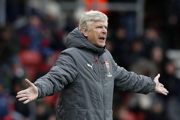 Arsenal's French manager Arsene Wenger reacts during the English Premier League football match between Southampton and Arsenal at St Mary's Stadium in Southampton, southern England on December 10, 2017. / AFP PHOTO / Adrian DENNIS / RESTRICTED TO EDITORIAL USE. No use with unauthorized audio, video, data, fixture lists, club/league logos or 'live' services. Online in-match use limited to 75 images, no video emulation. No use in betting, games or single club/league/player publications.  /         (Photo credit should read ADRIAN DENNIS/AFP/Getty Images)