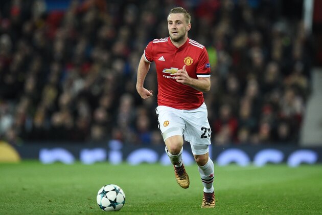 Manchester United's English defender Luke Shaw runs with the ball during the UEFA Champions League Group A football match between Manchester United and CSKA Moscow at Old Trafford in Manchester, north west England on December 5, 2017. / AFP PHOTO / Oli SCARFF        (Photo credit should read OLI SCARFF/AFP/Getty Images)