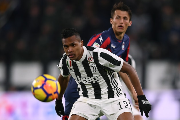 Juventus' defender Alex Sandro from Brazil eyes the ball during the Italian Serie A football match Juventus Vs Crotone on November 26, 2017 at the 'Allianz Stadium' in Turin.  / AFP PHOTO / MARCO BERTORELLO        (Photo credit should read MARCO BERTORELLO/AFP/Getty Images)