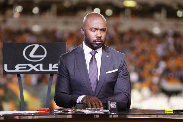 NFL analyst Marshall Faulk waits to speak during a half-time show of an NFL football game between the Cincinnati Bengals and the Houston Texans, Thursday, Sept. 14, 2017, in Cincinnati. (AP Photo/Frank Victores)