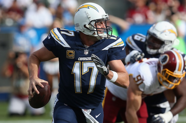 CARSON, CA - DECEMBER 10:  Quarterback Philip Rivers #17 of the Los Angeles Chargers rolls out with the ball in the first quarter against the Washington Redskins on December 10, 2017 at StubHub Center in Carson, California.  (Photo by Stephen Dunn/Getty Images)
