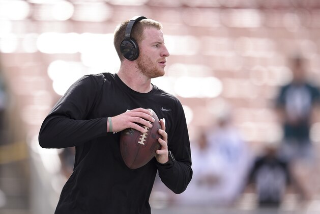 Philadelphia Eagles quarterback Carson Wentz warms up before an NFL football game against the Los Angeles Rams Sunday, Dec. 10, 2017, in Los Angeles. (AP Photo/Kelvin Kuo)