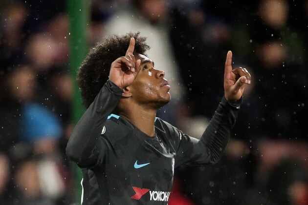 HUDDERSFIELD, ENGLAND - DECEMBER 12: Willian of Chelsea celebrates after scoring a goal to make it 0-2 during the Premier League match between Huddersfield Town and Chelsea at John Smith's Stadium on December 12, 2017 in Huddersfield, England. (Photo by Robbie Jay Barratt - AMA/Getty Images)