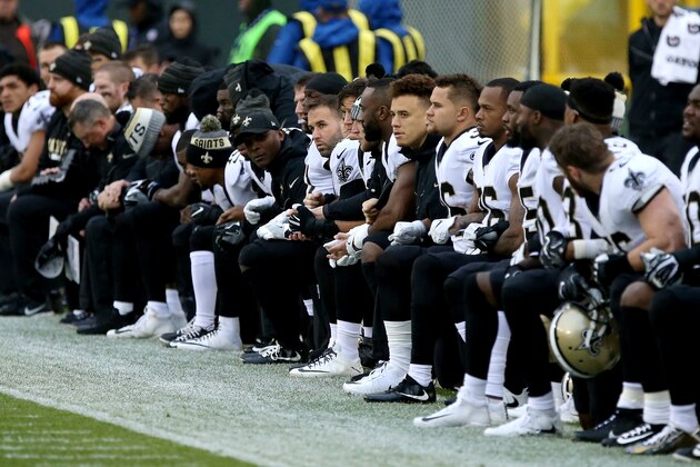 GREEN BAY, WI - OCTOBER 22:  The New Orleans Saints kneel before the playing of the national anthem before the game against the Green Bay Packers at Lambeau Field on October 22, 2017 in Green Bay, Wisconsin. (Photo by Dylan Buell/Getty Images)