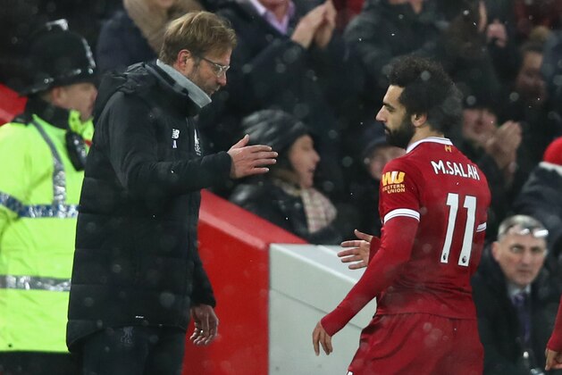 LIVERPOOL, ENGLAND - DECEMBER 10:  Jurgen Klopp speaks with Mohamed Salah of Liverpool during the Premier League match between Liverpool and Everton at Anfield on December 10, 2017 in Liverpool, England.  (Photo by Clive Brunskill/Getty Images)