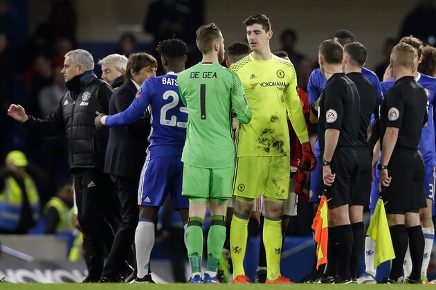 Rival goalkeepers Manchester United's David de Gea and Chelsea's Thibaut Courtois talk following their English FA Cup quarterfinal soccer at Stamford Bridge stadium in London, Monday, March 13, 2017 (AP Photo/Alastair Grant)