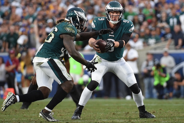 LOS ANGELES, CA - DECEMBER 10:  Quarterback Nick Foles #9 of the Philadelphia Eagles hands off the ball to running back Jay Ajayi #36 of the Philadelphia Eagles during the fourth quarter against Los Angeles Rams at Los Angeles Memorial Coliseum on December 10, 2017 in Los Angeles, California. Foles replaced injured starting quarterback Carson Wentz. (Photo by Kevork Djansezian/Getty Images)