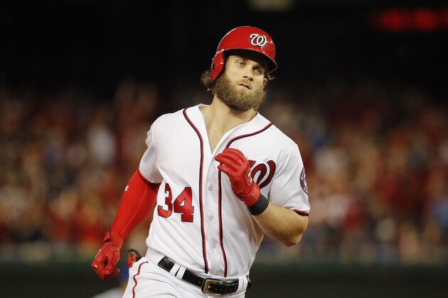 Washington Nationals Bryce Harper circles the bases after hitting a two-run homer off Chicago Cubs relief pitcher Carl Edwards Jr. to tie the game in the eight inning in Game 2 of baseball's National League Division Series a, at Nationals Park, Saturday, Oct. 7, 2017, in Washington. National won 6-3. (AP Photo/Pablo Martinez Monsivais)