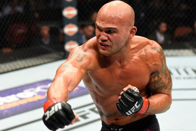 ANAHEIM, CA - JULY 29:  (R-L) Robbie Lawler punches  Donald Cerrone in their welterweight bout during the UFC 214 event inside the Honda Center on July 29, 2017 in Anaheim, California. (Photo by Josh Hedges/Zuffa LLC/Zuffa LLC via Getty Images)